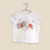 White cotton t-shirt with a butterfly and flower print, baby size 0–3 months, front