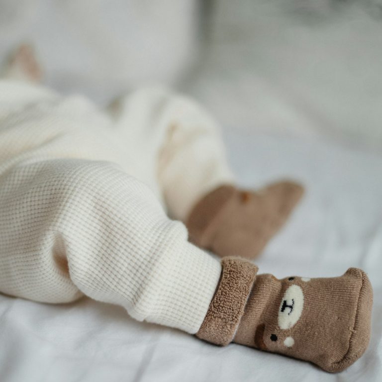 Cream waffle knit baby trousers with a soft teddy bootie