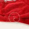 Red velour sweatshirt, close-up of a small stitch mark under the arm