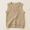 velke-1.png Pepco oatmeal cotton knit tank with a pink embroidered bow, kids size 8–10 years, front