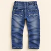 Black Tuna jeans in mid blue, size 6-7 years (122 cm), back with wave-stitched pockets and fish patch
