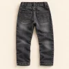 F&F five-pocket jeans in washed black, size 6-7 years (122 cm), back with elasticated waist and pockets