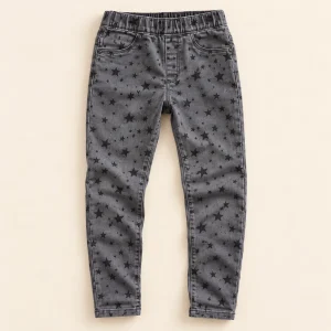 F&F stretch jeans in washed grey with black star print, size 12-13 years (158 cm), front with elastic waist