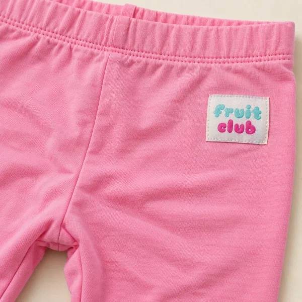 So Cute leggings in bubblegum pink, 18–24 months, close-up of the fruit club patch and waistband
